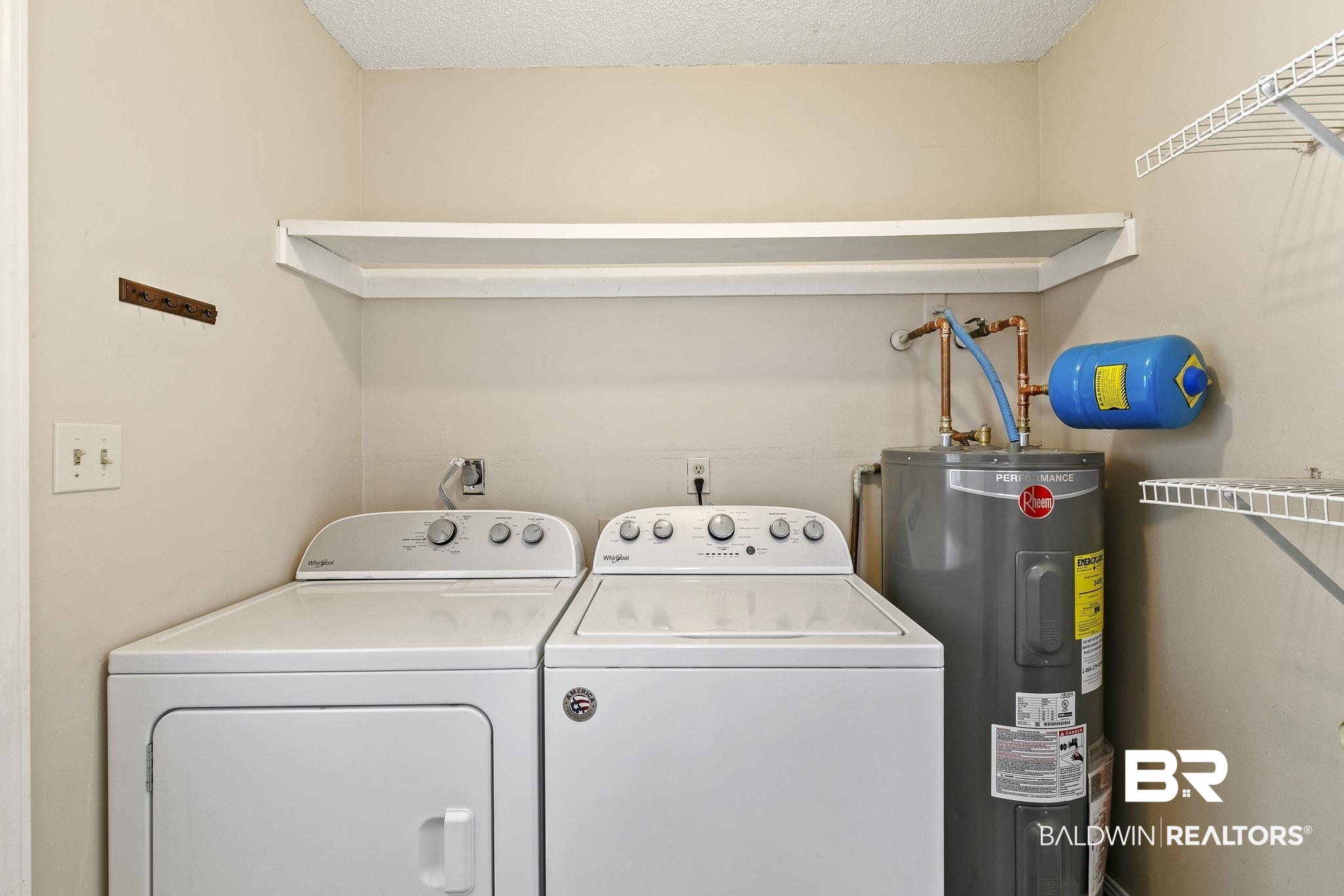 359 Ridgewood Drive Daphne, AL 36526 - Photo 25 of 73 Laundry room with electric water heater, a textured ceiling, and washer and clothes dryer