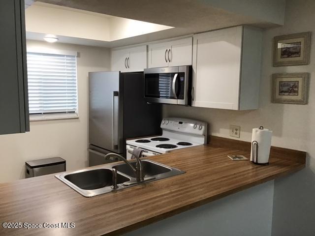 1720 Murrell Road, Unit 207 Rockledge, FL 32955 - Photo 4 of 18 Kitchen Looking from fam room