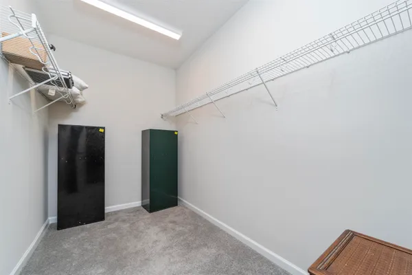 a view of a hallway with closet