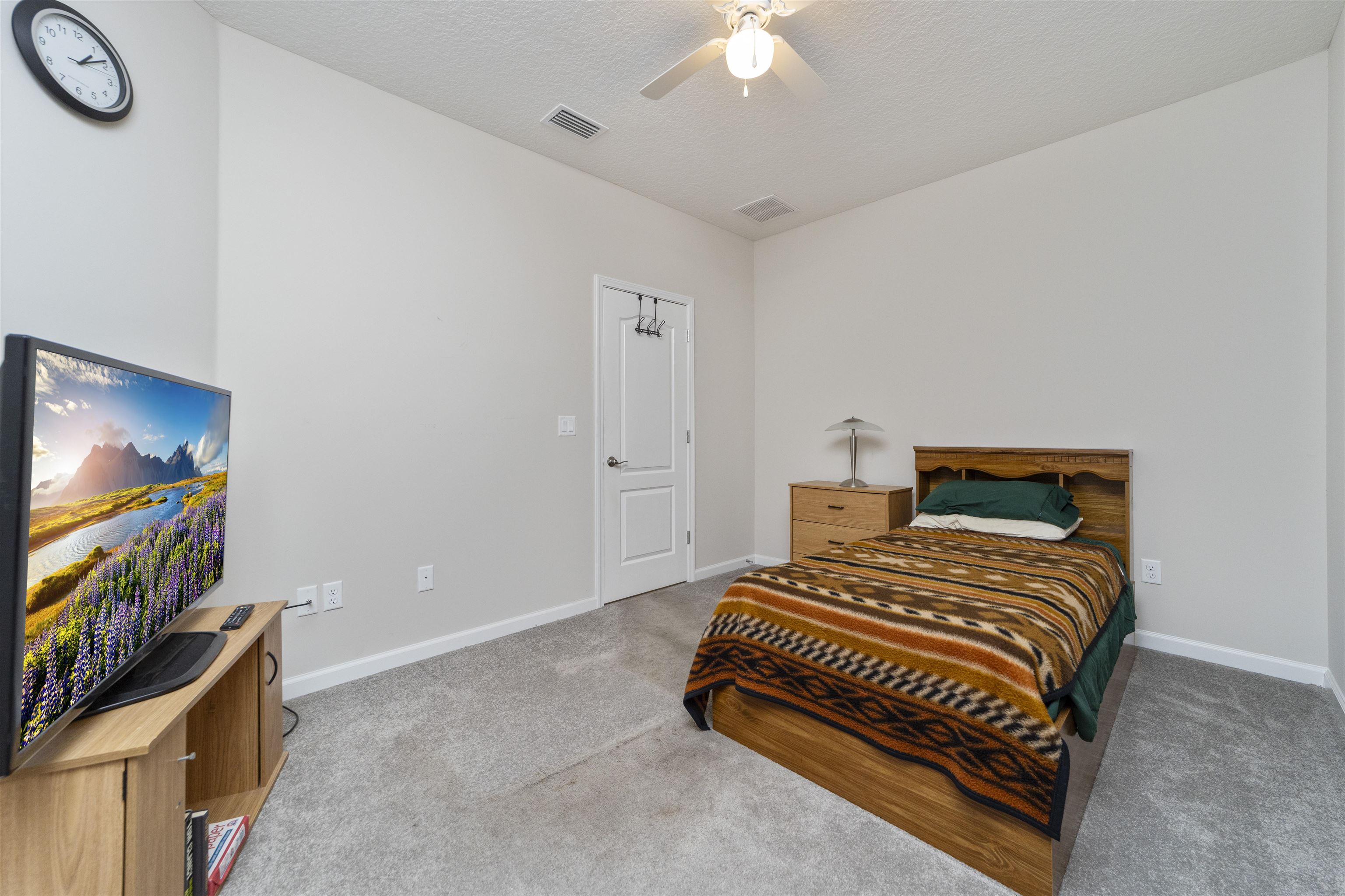 850 East Watson Road St. Augustine, FL 32086 - Photo 27 of 38 a bedroom with a bed and a flat screen tv