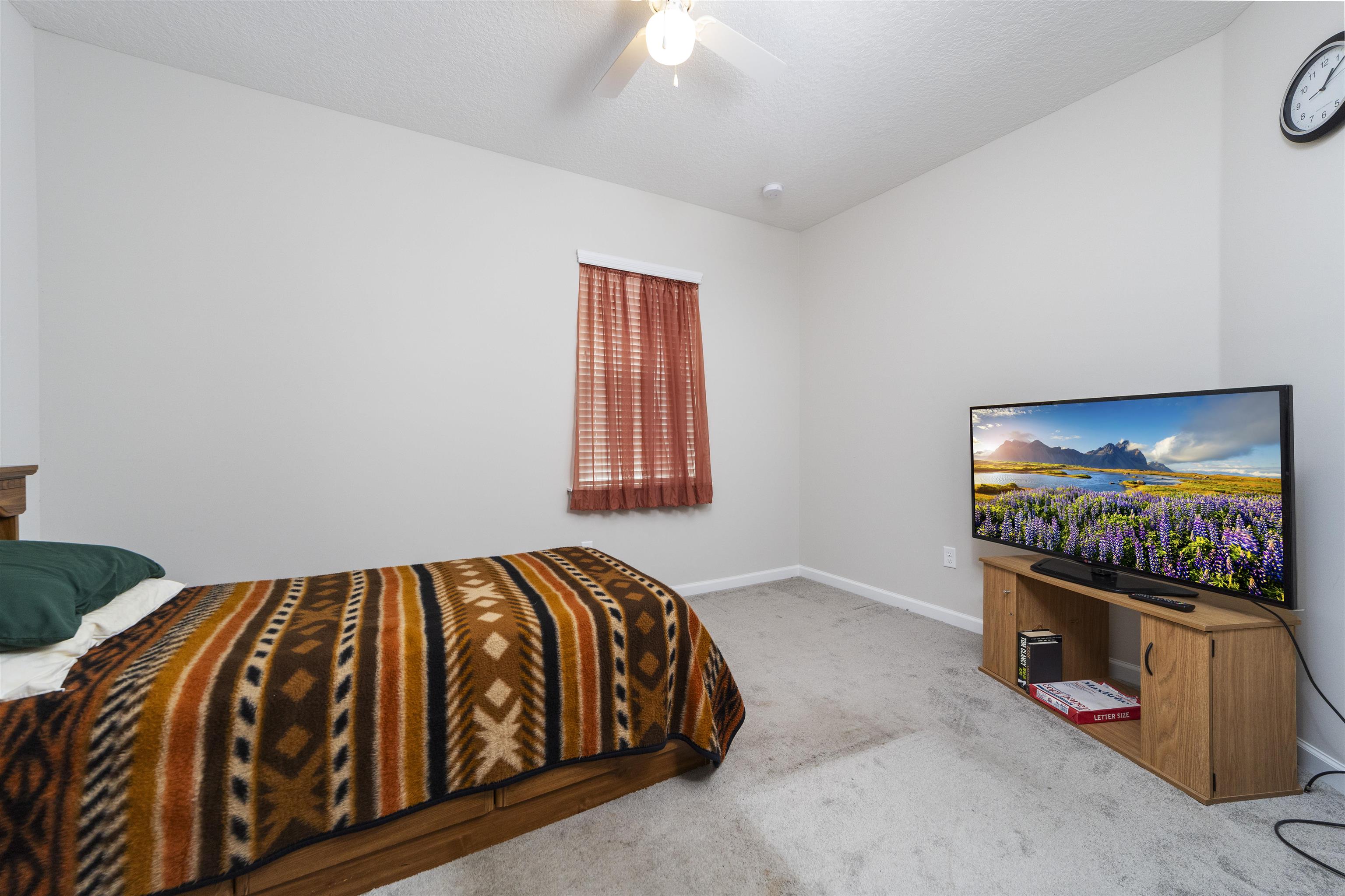 850 East Watson Road St. Augustine, FL 32086 - Photo 29 of 38 a bedroom with bed and a flat screen tv