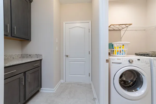 a view of a storage and utility room with a washer and dryer