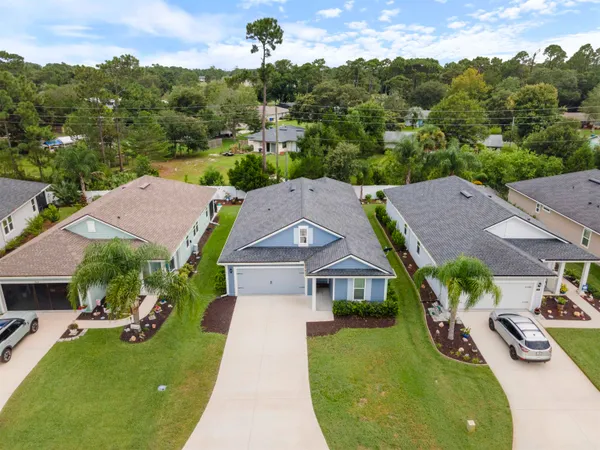 an aerial view of a house with garden