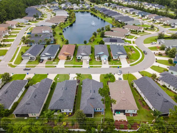 an aerial view of residential houses with outdoor space