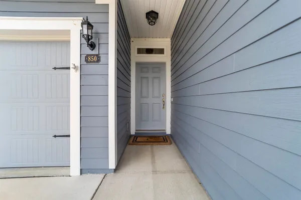 a view of a door and a window