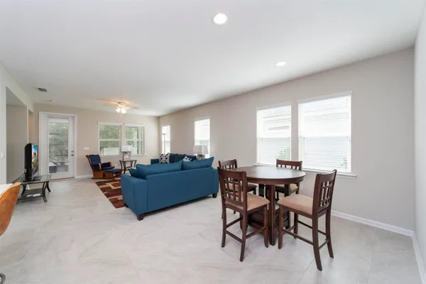 a view of a dining room with furniture window and outside view