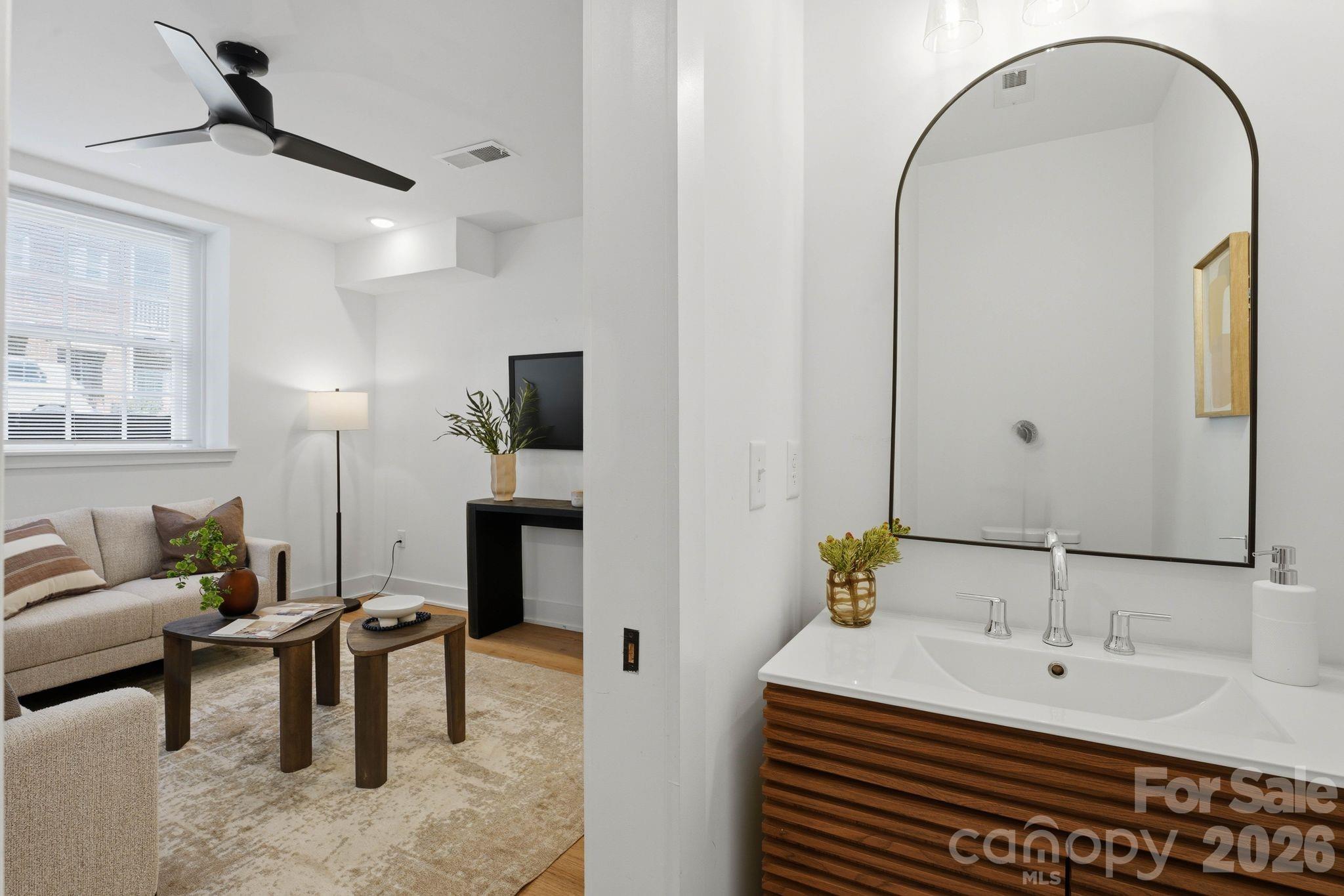 201 Grandin Road, Unit 6 Charlotte, NC 28208 - Photo 5 of 45 a en suite bathroom with a double vanity sink and a mirror