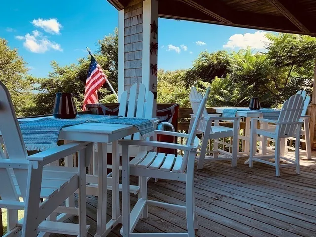 a view of a balcony with chairs
