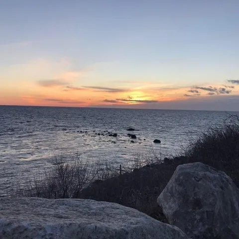 a view of ocean and mountain