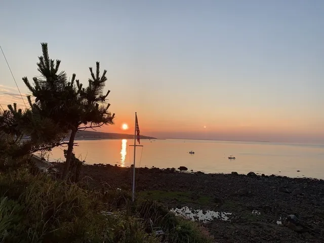 a view of ocean and sunset
