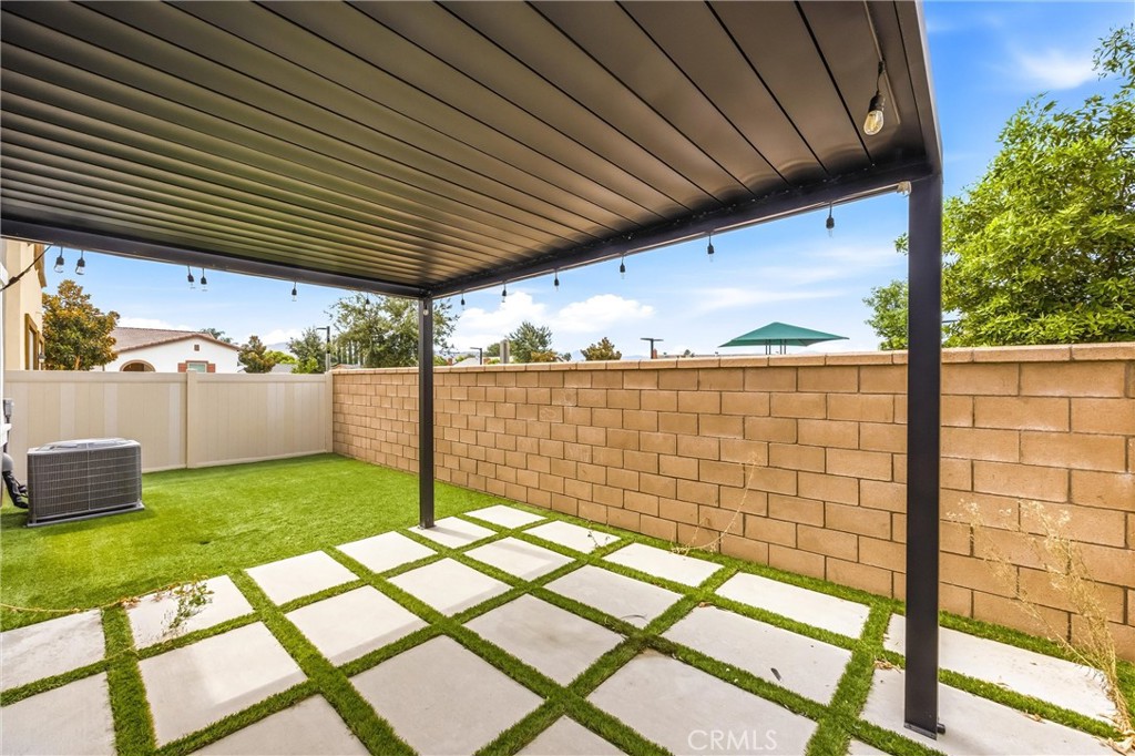 4247 Bravado Court Riverside, CA 92505 - Photo 44 of 60 Covered backyard patio with a low-maintenance outdoor space, ideal for relaxing or entertaining