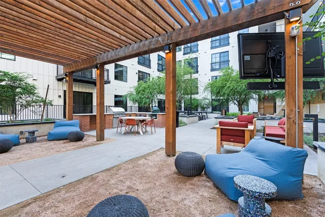 a outdoor space with patio the couches and a dining table with chairs