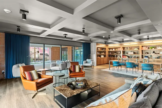 a living room with furniture and a table