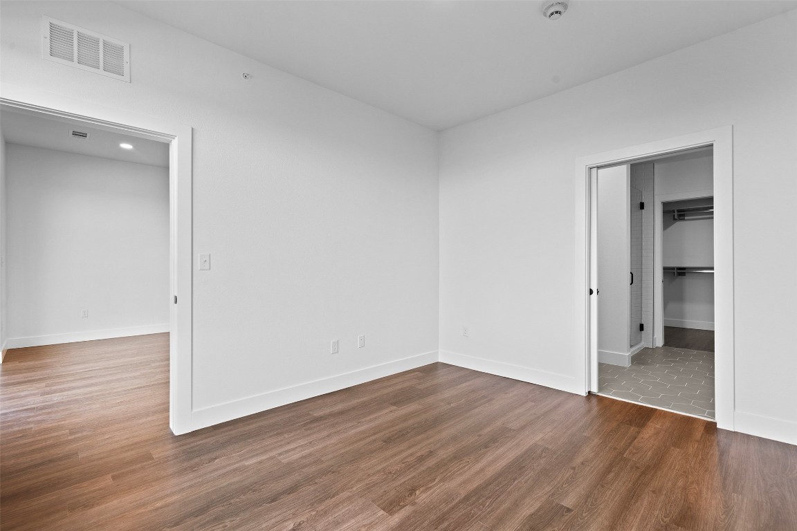 4315 South Congress Avenue, Unit 433 Austin, TX 78745 - Photo 9 of 23 a view of a room with wooden floor and a sink