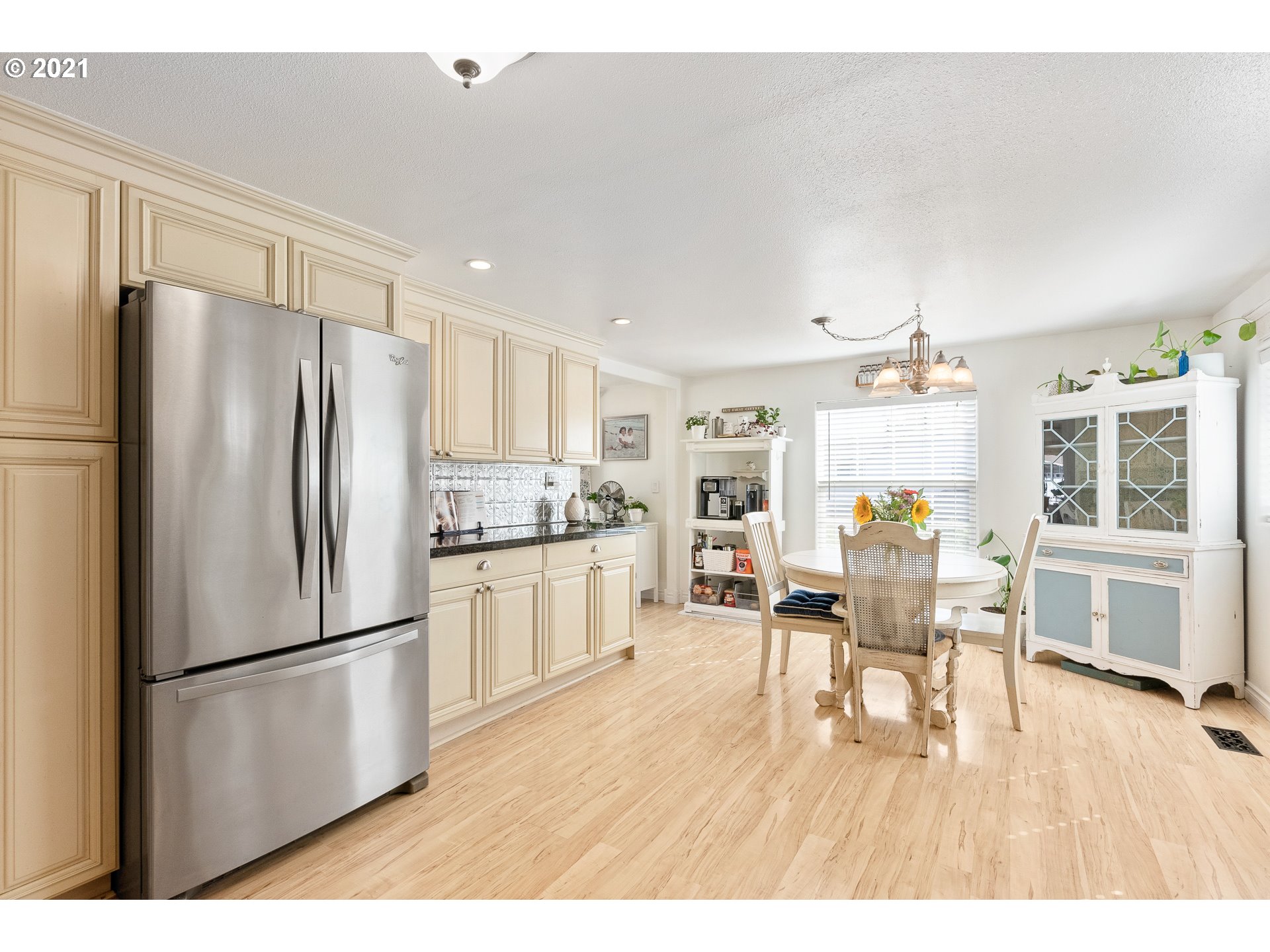 4887 E Street Springfield, OR 97478 - Photo 8 of 31 a kitchen with stainless steel appliances a refrigerator and wooden floor