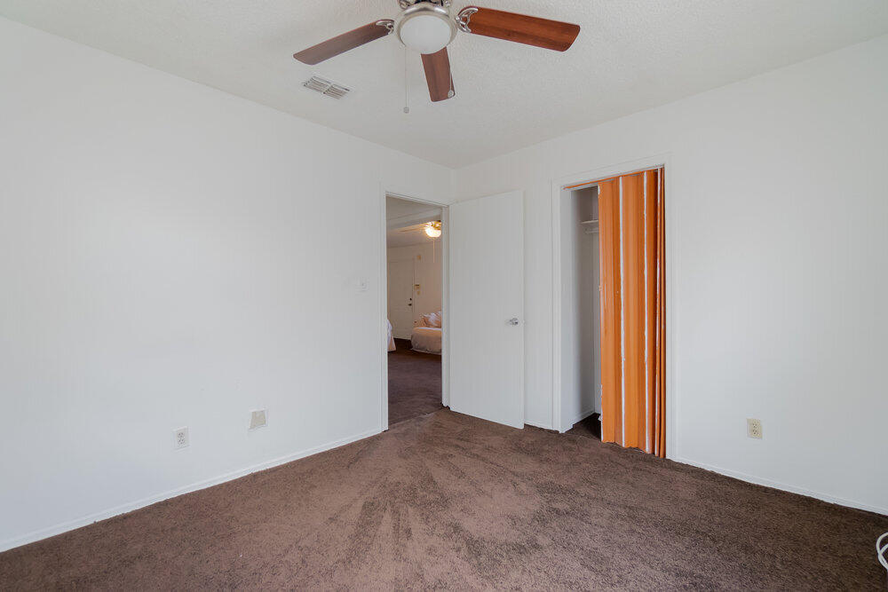 1564 West 20th Street Riviera Beach, FL 33404 - Photo 18 of 23 an empty room with ceiling fan and window