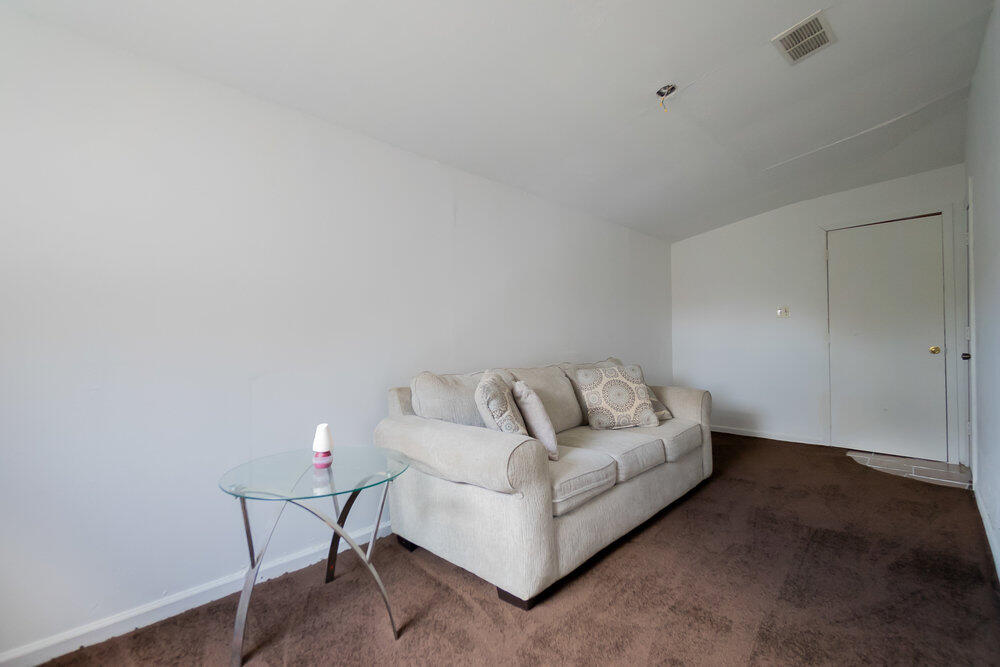 1564 West 20th Street Riviera Beach, FL 33404 - Photo 19 of 23 a living room with furniture and a couch