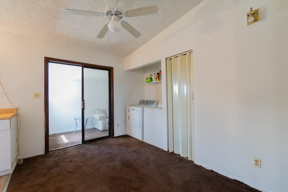 1564 West 20th Street Riviera Beach, FL 33404 - Photo 21 of 23 a view of empty room with wooden floor and fan