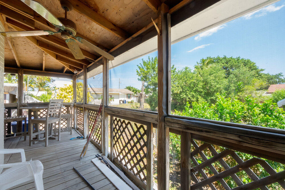 1564 West 20th Street Riviera Beach, FL 33404 - Photo 23 of 23 a view of a porch with wooden floor
