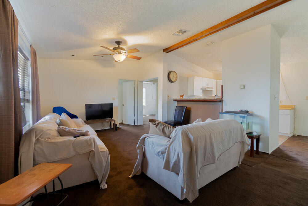 1564 West 20th Street Riviera Beach, FL 33404 - Photo 3 of 23 a bedroom with furniture and a fireplace