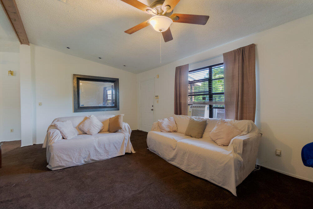 1564 West 20th Street Riviera Beach, FL 33404 - Photo 4 of 23 a living room with furniture and a large window