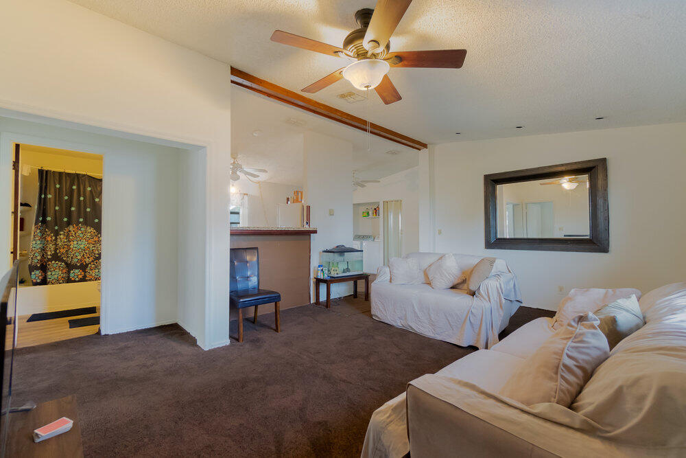1564 West 20th Street Riviera Beach, FL 33404 - Photo 6 of 23 a living room with furniture and a ceiling fan