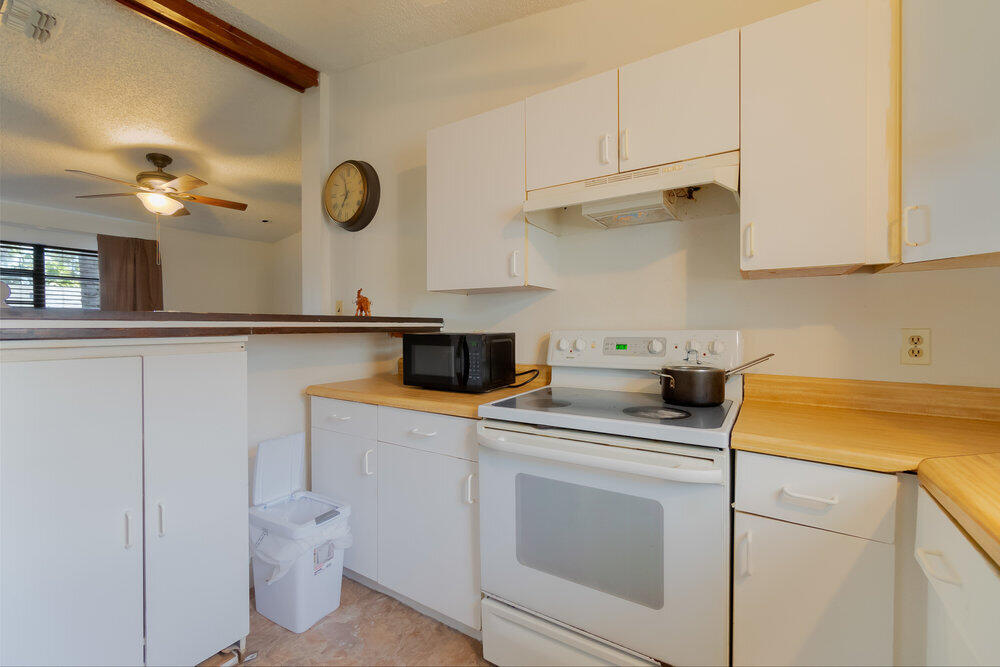 1564 West 20th Street Riviera Beach, FL 33404 - Photo 8 of 23 a kitchen with a sink and cabinets