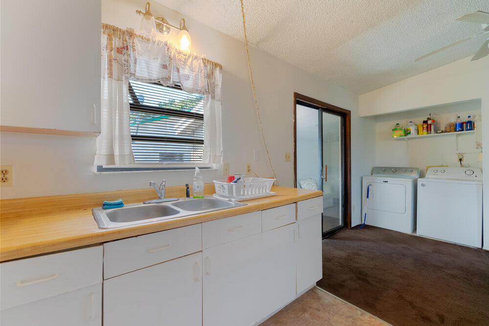 1564 West 20th Street Riviera Beach, FL 33404 - Photo 9 of 23 a kitchen with a sink cabinets and utility
