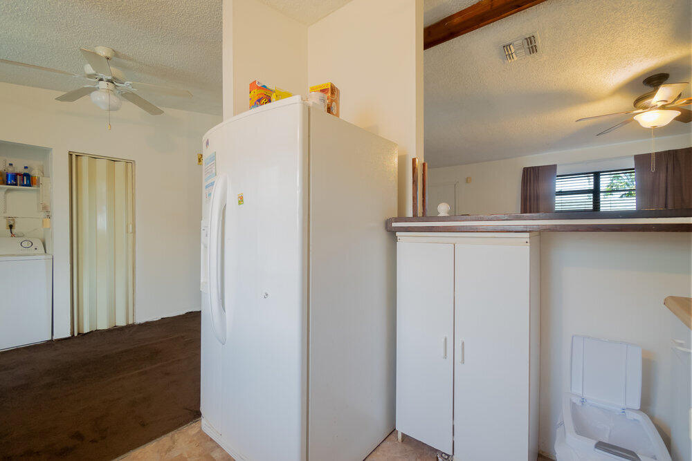 1564 West 20th Street Riviera Beach, FL 33404 - Photo 10 of 23 a view of a kitchen with closet and wooden floor