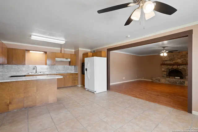 a view of a kitchen with a sink and cabinet