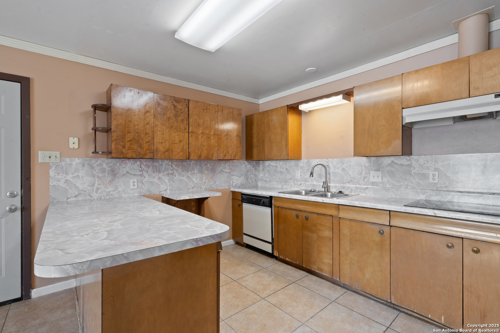 203 Margaret Lane Del Rio, TX 78840 - Photo 18 of 42 a kitchen with a sink and cabinets