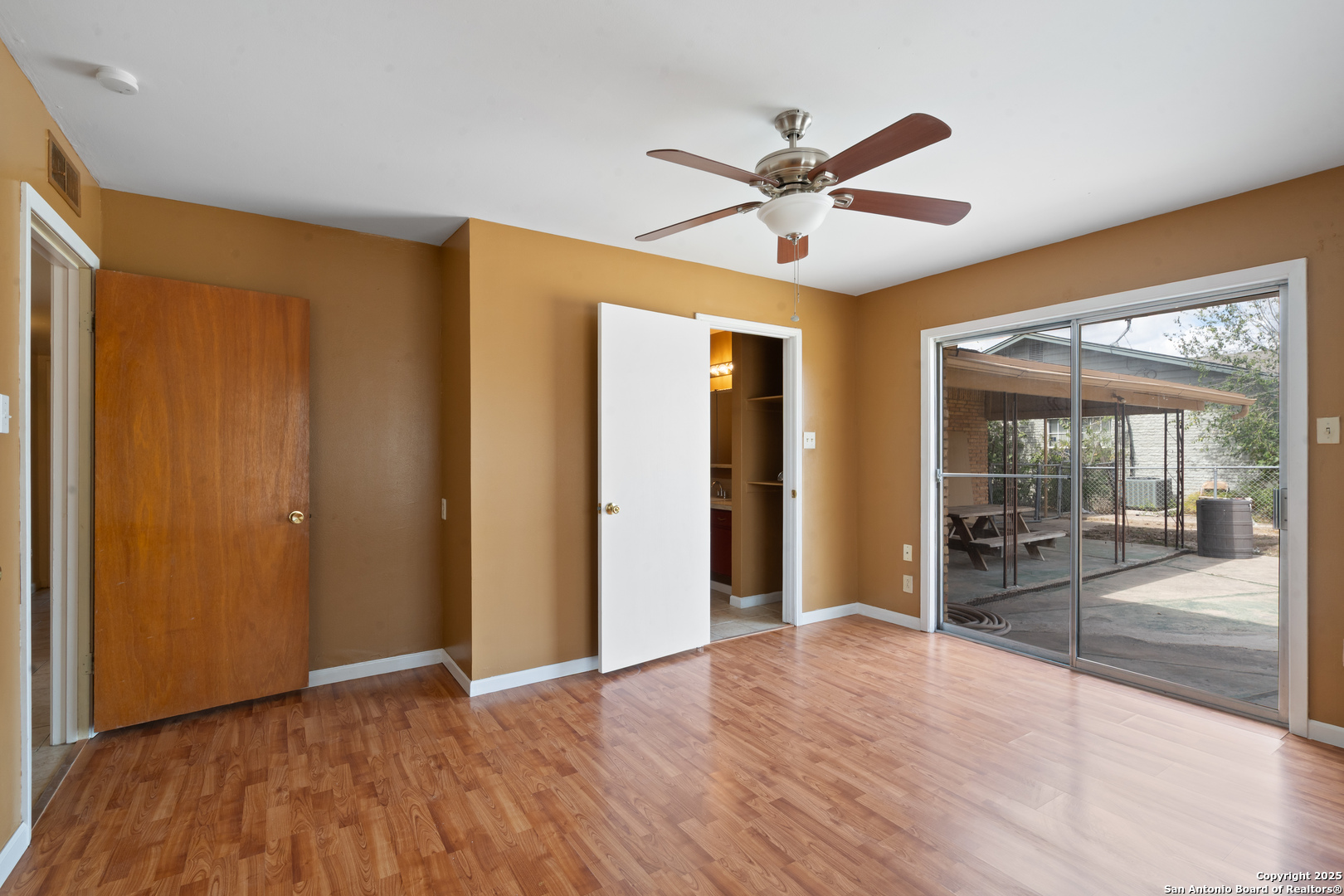 203 Margaret Lane Del Rio, TX 78840 - Photo 22 of 42 a view of a livingroom with a chandelier fan and a large window