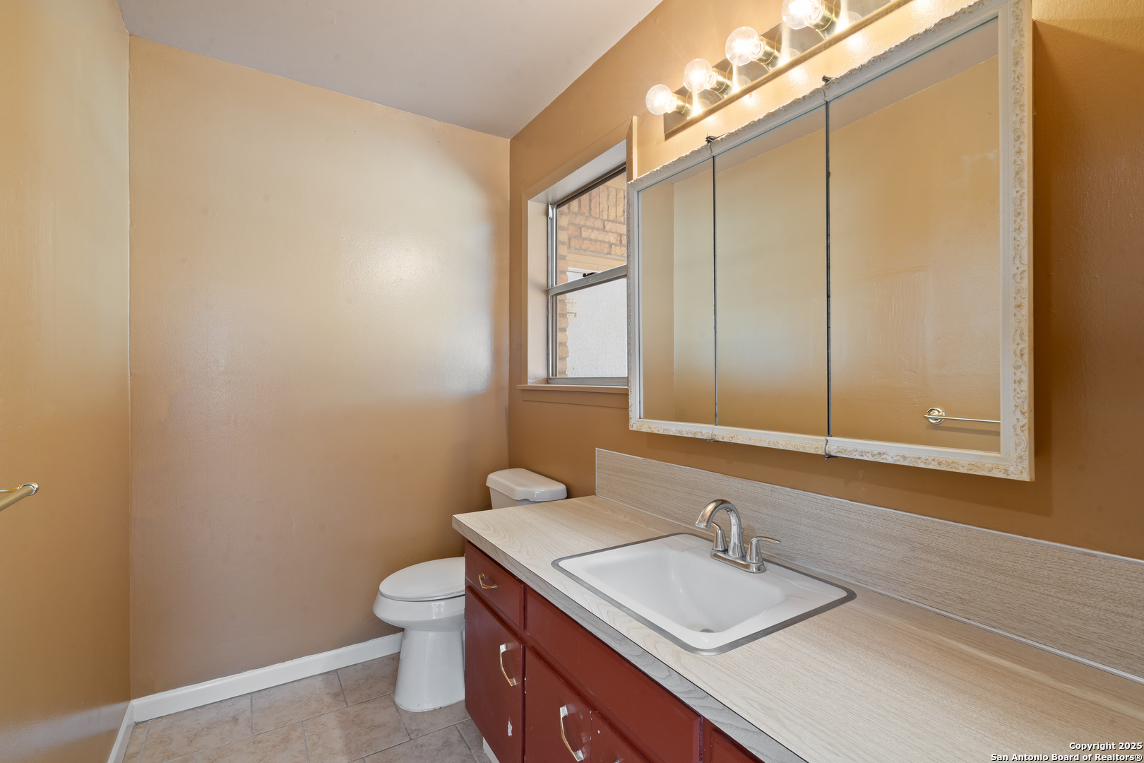 203 Margaret Lane Del Rio, TX 78840 - Photo 24 of 42 a bathroom with a granite countertop sink toilet and a mirror