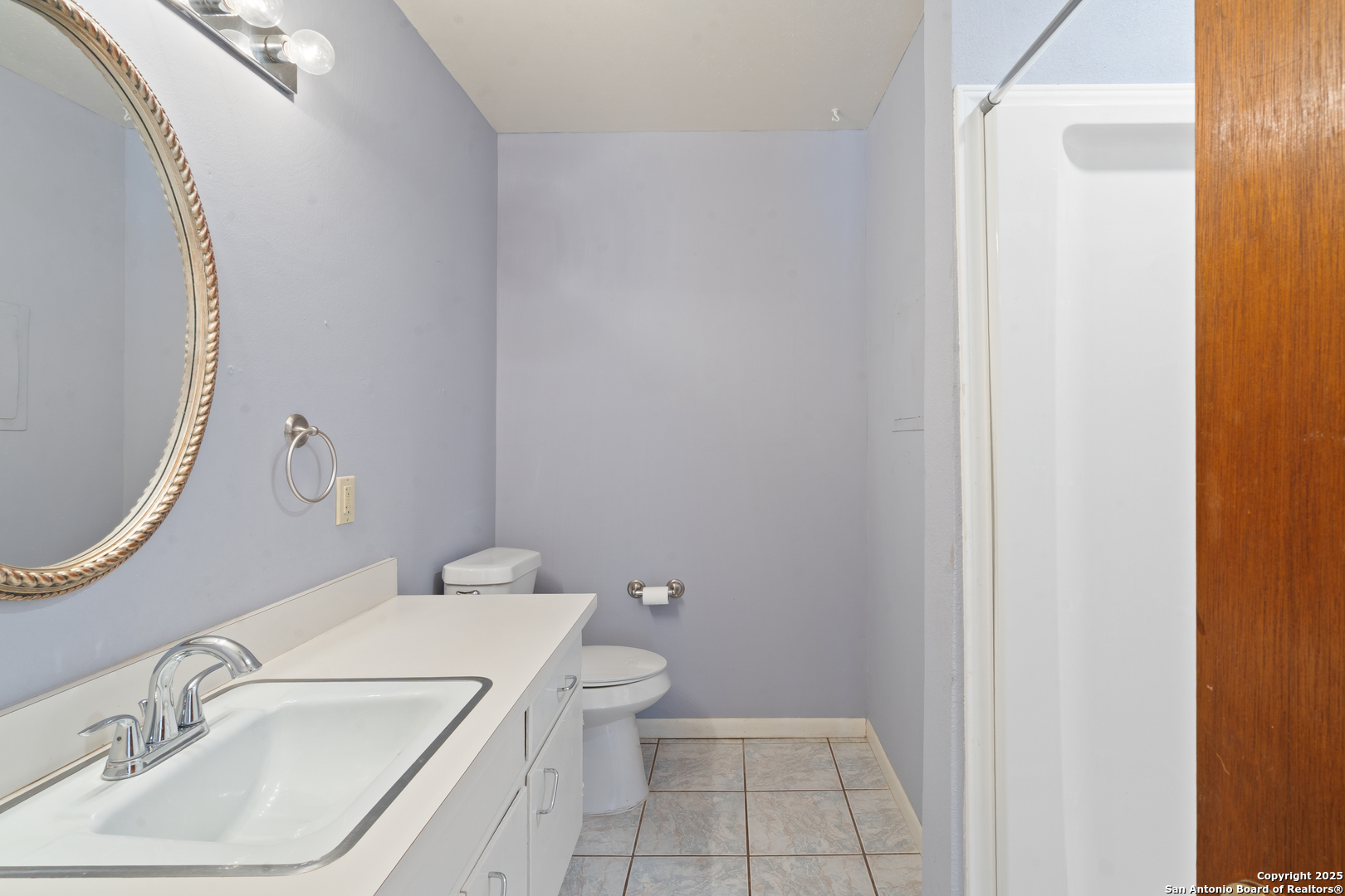 203 Margaret Lane Del Rio, TX 78840 - Photo 33 of 42 a bathroom with a sink a toilet and a mirror