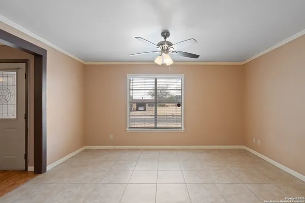 a view of an empty room with a window