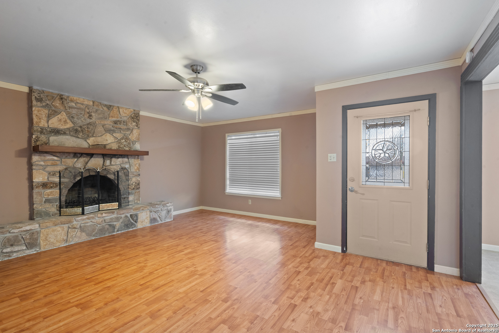 203 Margaret Lane Del Rio, TX 78840 - Photo 6 of 42 a view of empty room with fireplace and wooden floor