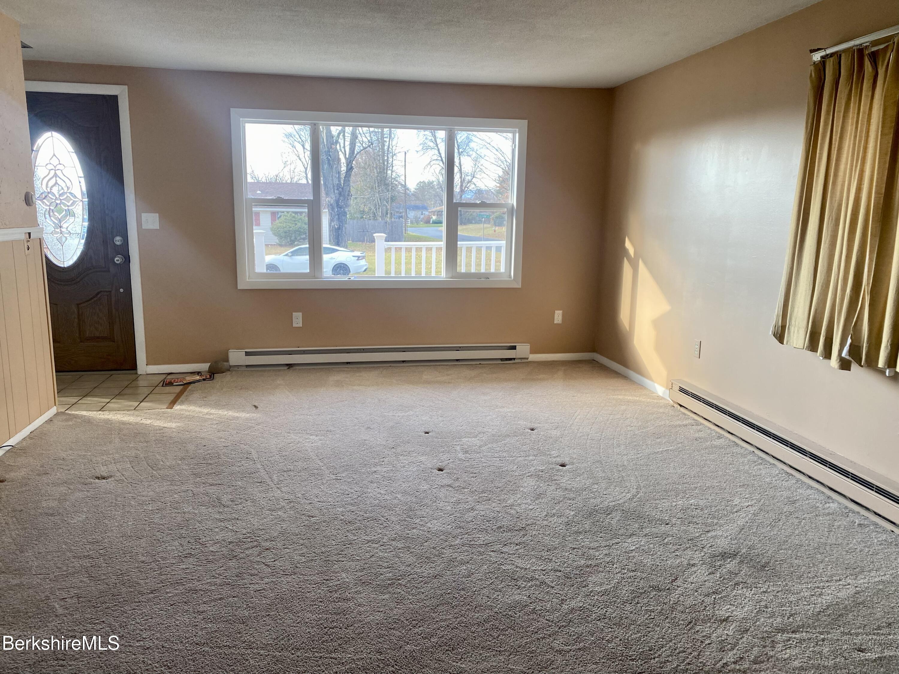 44 Eleanor Road Dalton, MA 01226 - Photo 17 of 36 an empty room with windows and mirror