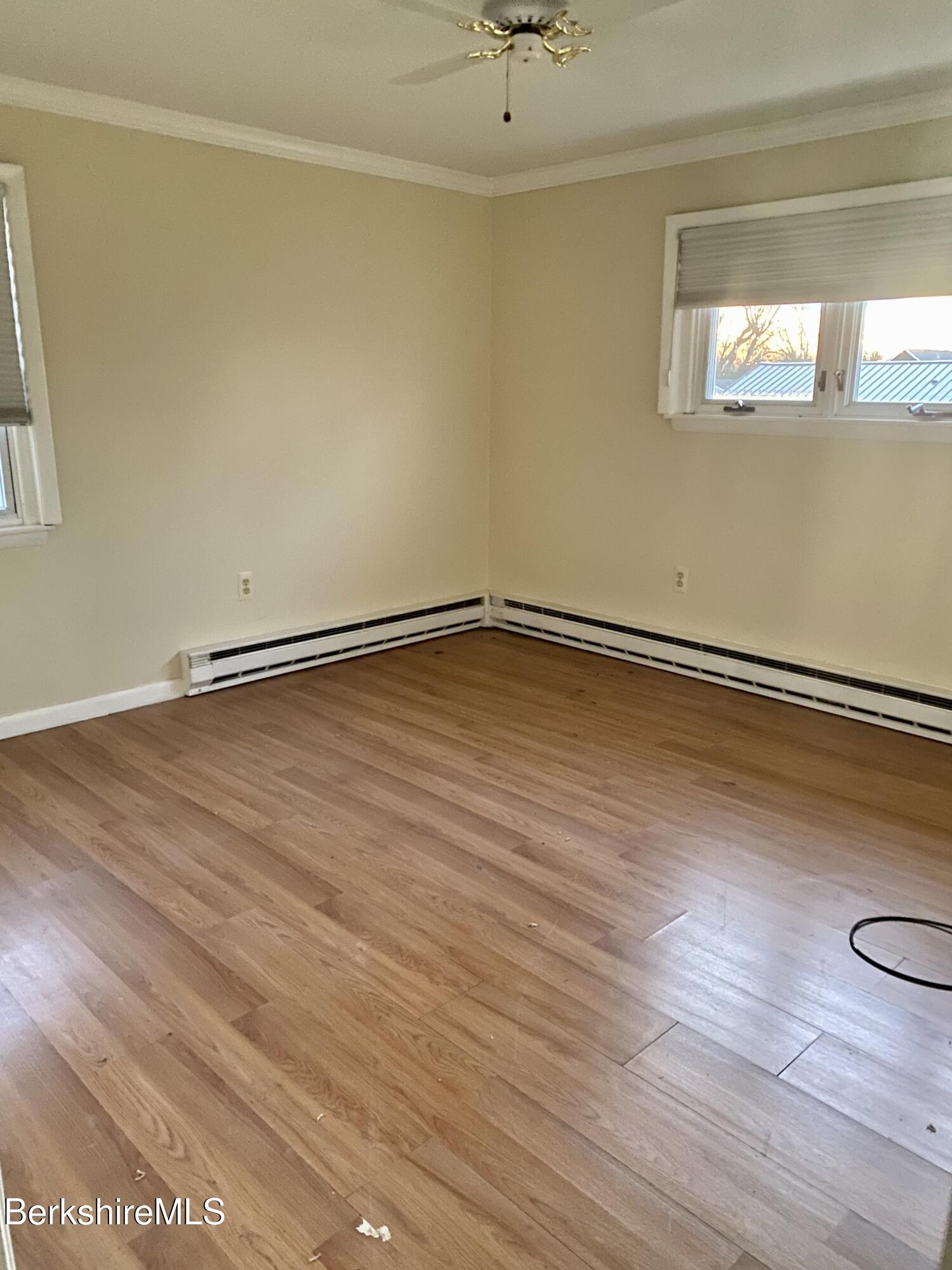 44 Eleanor Road Dalton, MA 01226 - Photo 19 of 36 a view of an empty room with wooden floor and a window