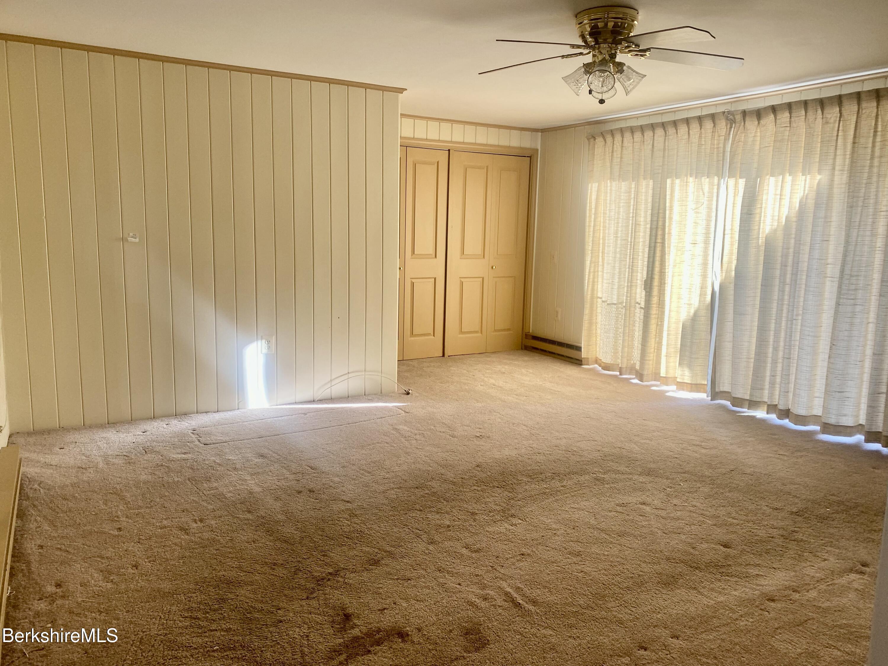 44 Eleanor Road Dalton, MA 01226 - Photo 26 of 36 an empty room with a empty space and windows