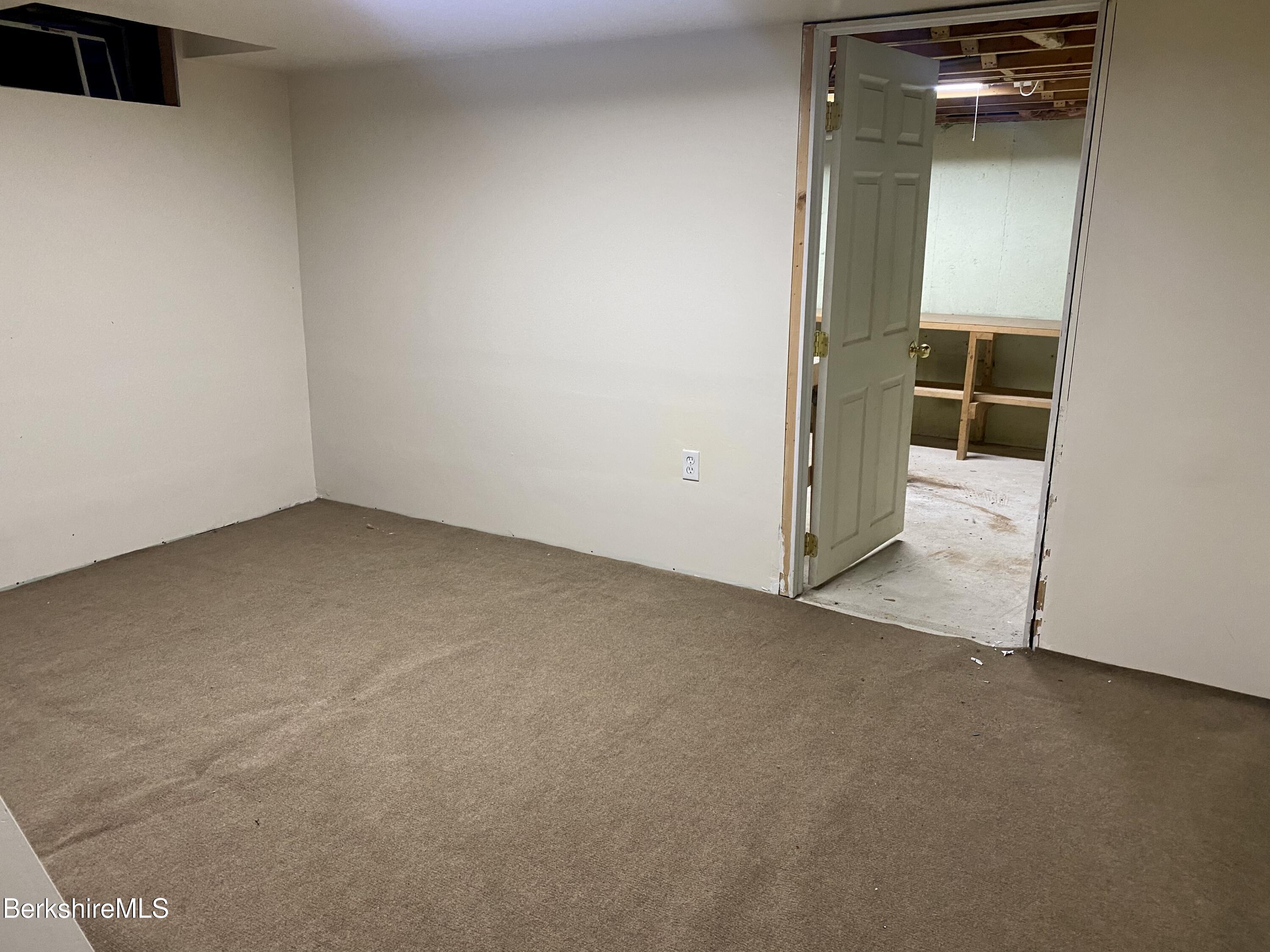 44 Eleanor Road Dalton, MA 01226 - Photo 31 of 36 an empty room with a workbench