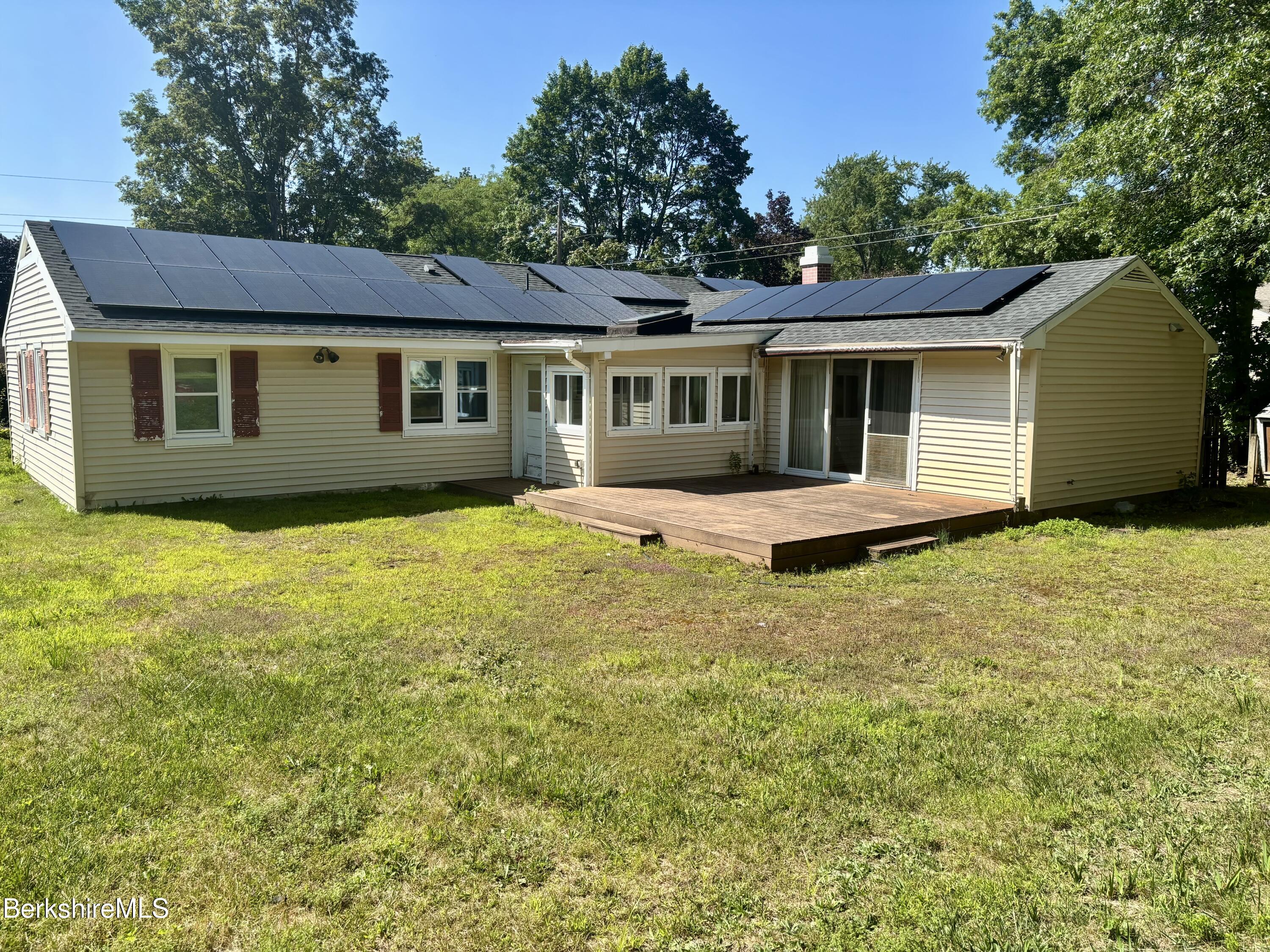 44 Eleanor Road Dalton, MA 01226 - Photo 4 of 36 a backyard of a house with yard table and chairs