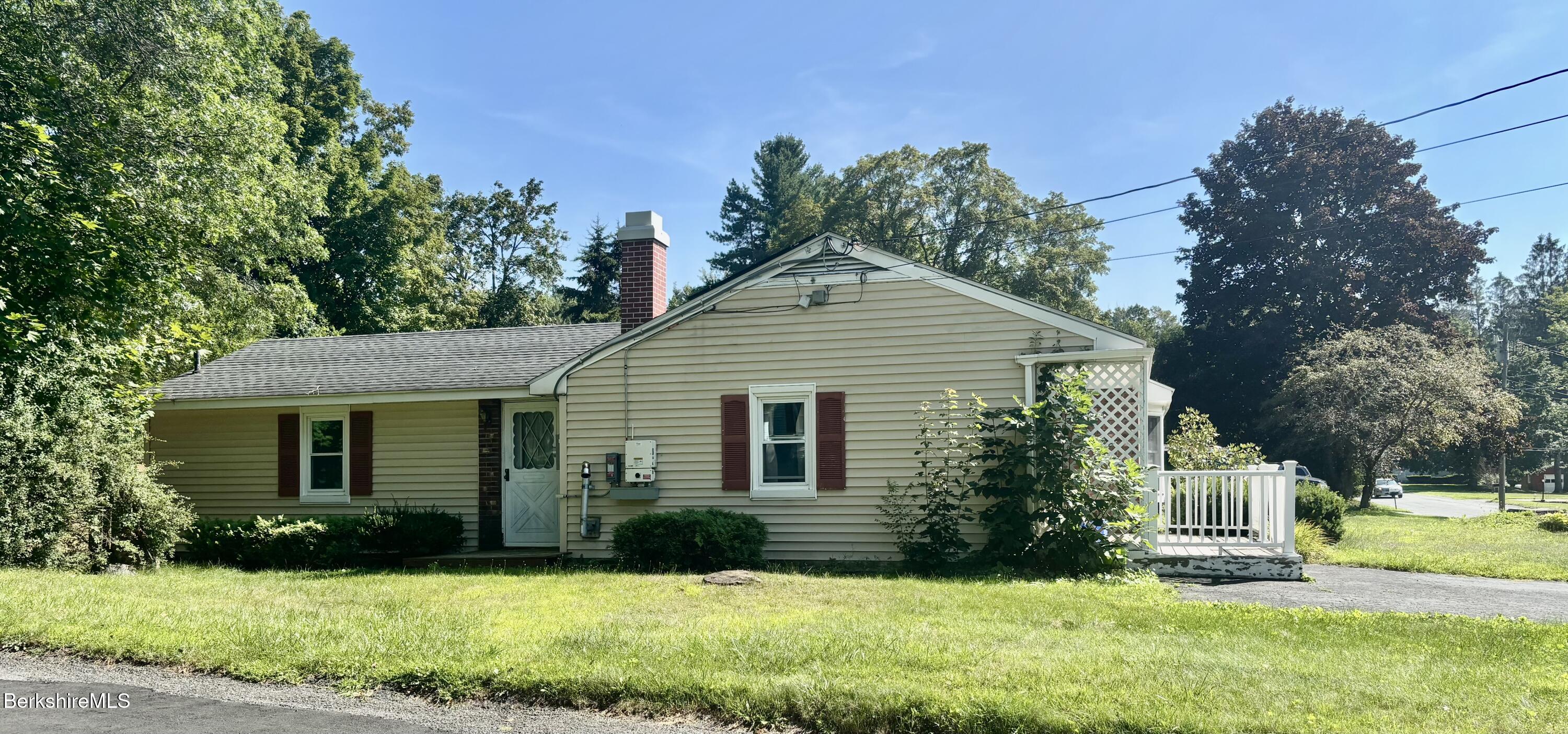 44 Eleanor Road Dalton, MA 01226 - Photo 5 of 36 a front view of a house with a yard and trees