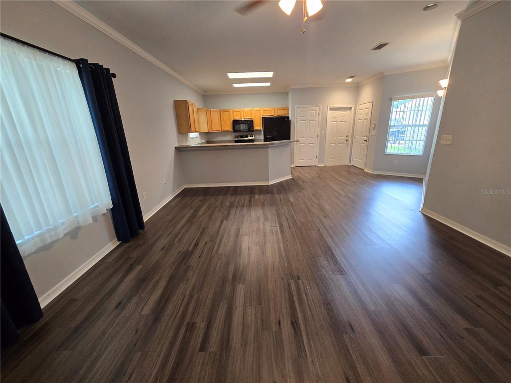 7976 48 Way Gainesville, FL 32653 - Photo 8 of 26 a view of a kitchen with wooden floor and a sink