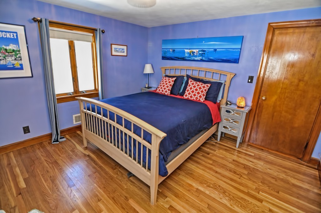 38 Shetland Road Marblehead, MA 01945 - Photo 11 of 23 a bedroom with a bed and wooden floor