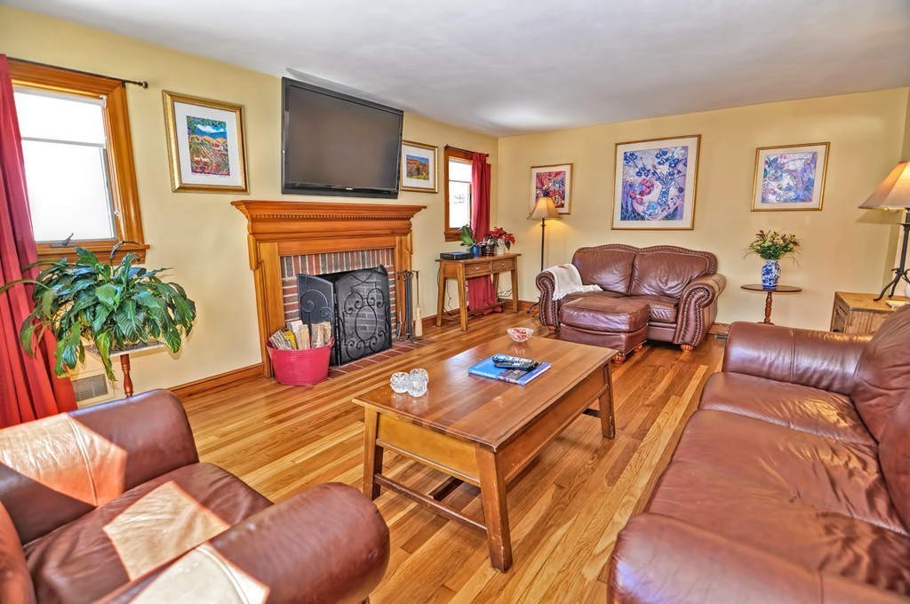 38 Shetland Road Marblehead, MA 01945 - Photo 5 of 23 a living room with furniture a fireplace and a potted plant