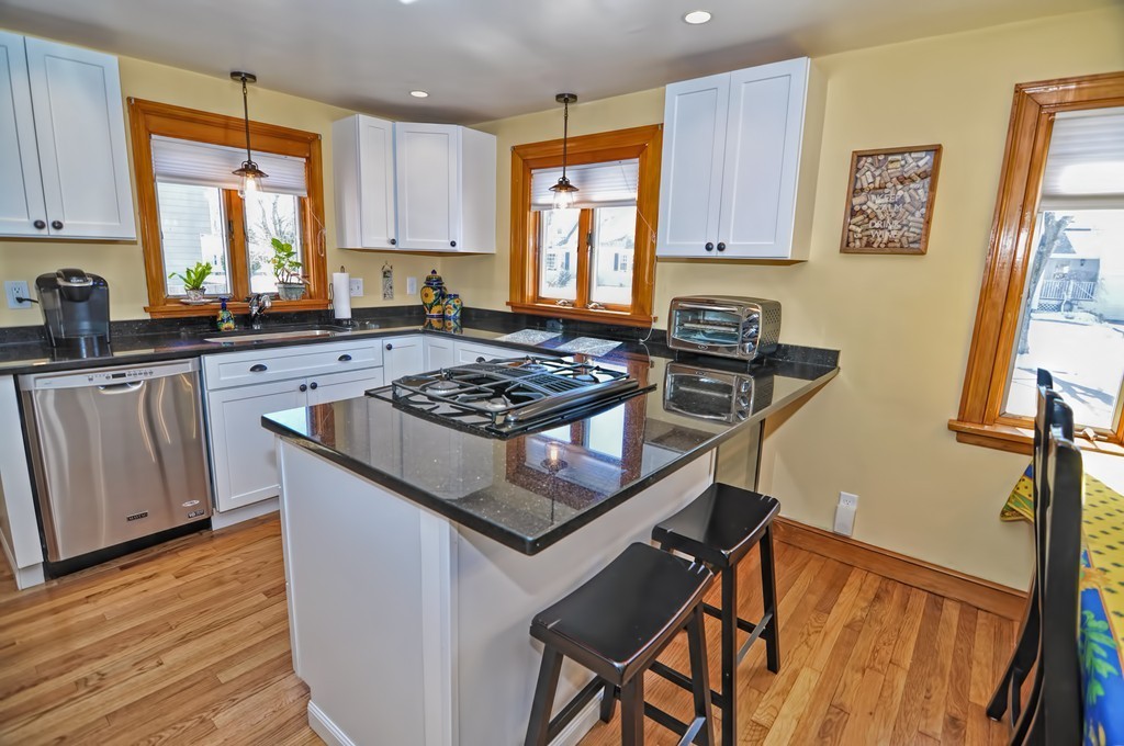 38 Shetland Road Marblehead, MA 01945 - Photo 8 of 23 a kitchen with a stove a sink wooden floor and a window