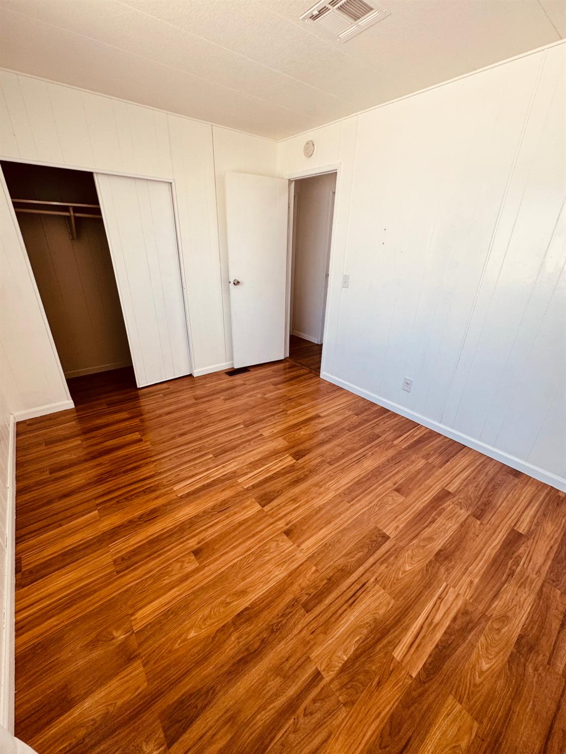260 West Comet Road Gustine, CA 95322 - Photo 13 of 20 a view of an empty room with wooden floor
