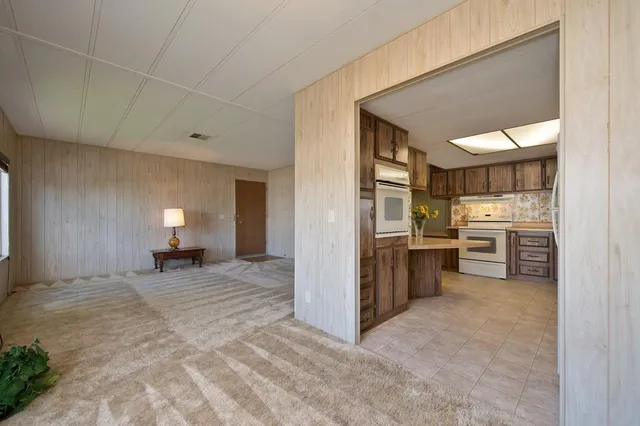 a kitchen with stainless steel appliances a refrigerator and stove