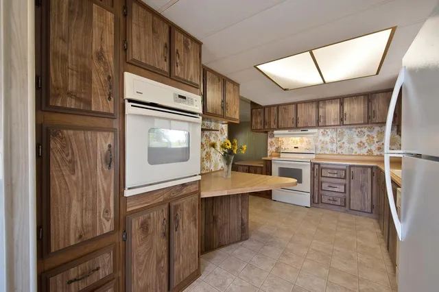 a view of kitchen island with tub and windows