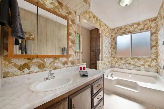 a view of a lush green space with sea